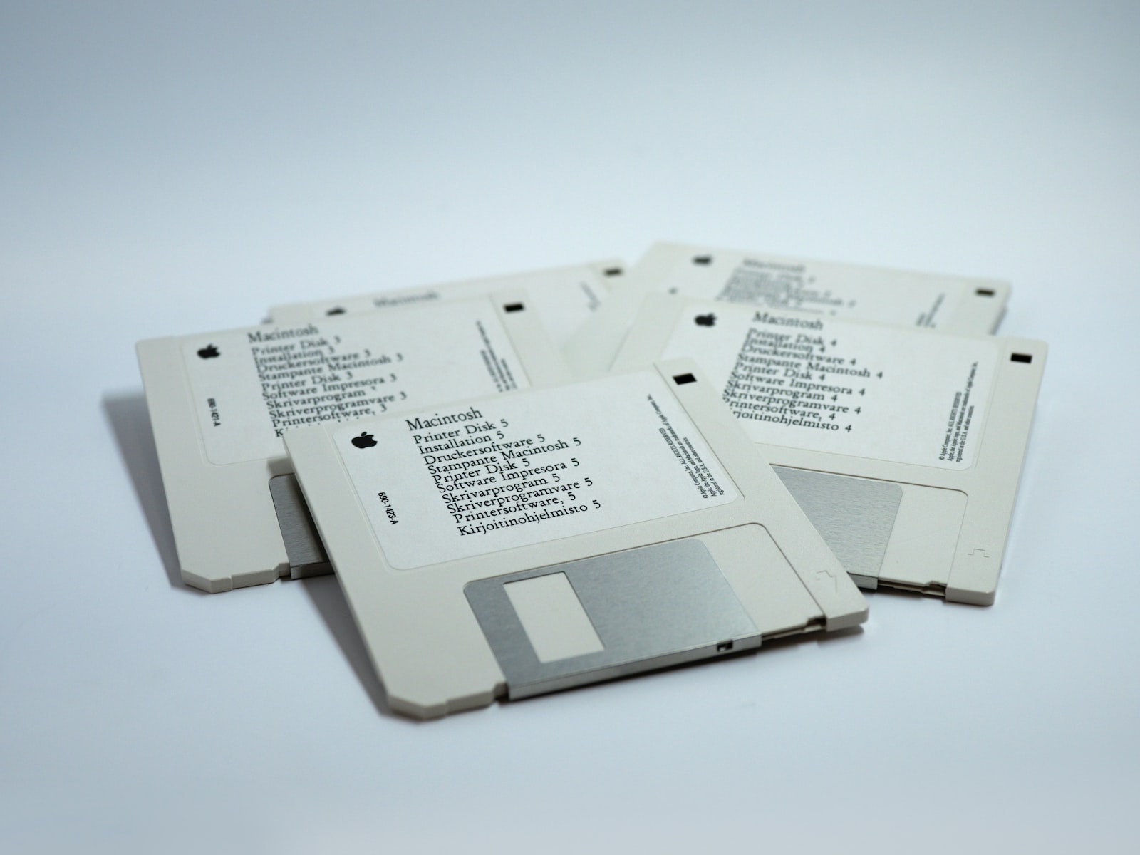 four MacBook diskettes